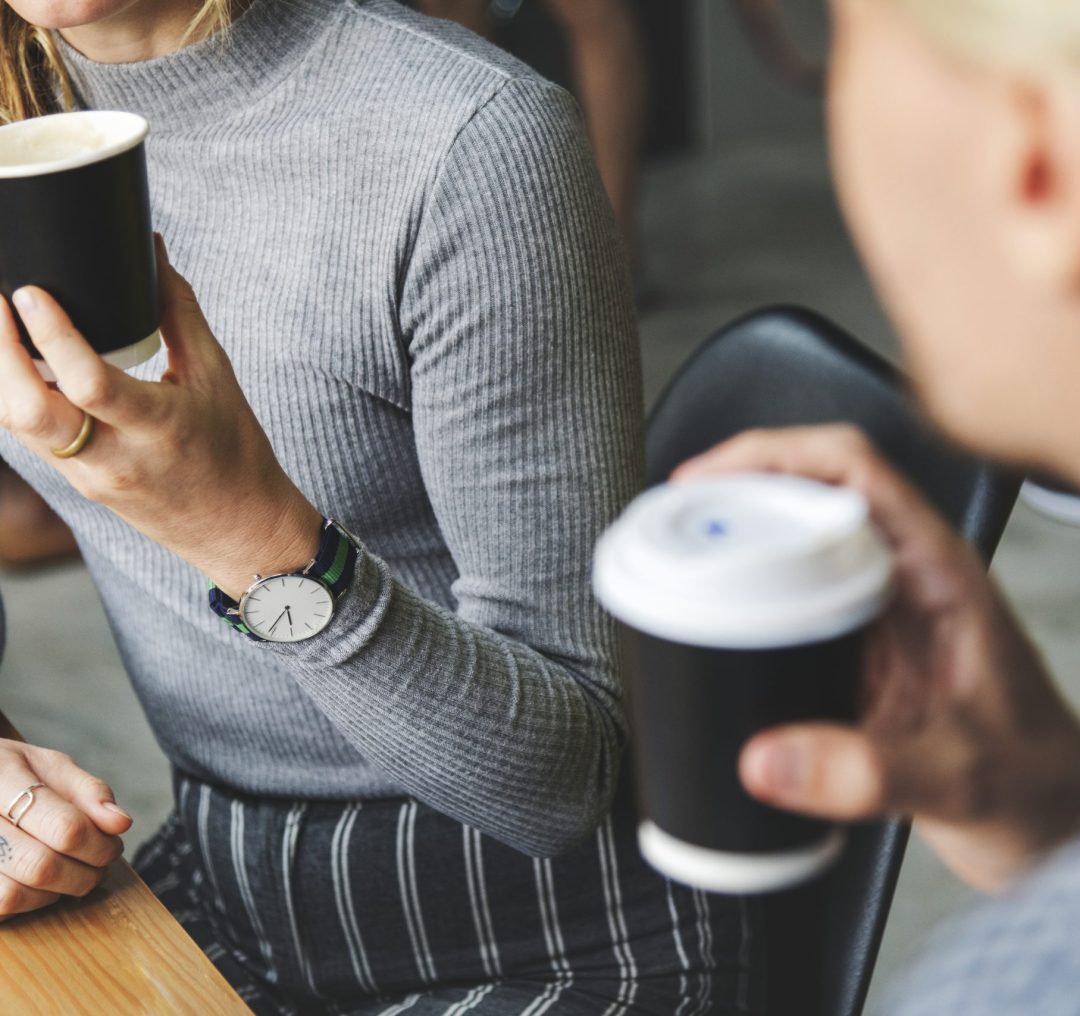 friends-enjoying-hot-coffee-together
