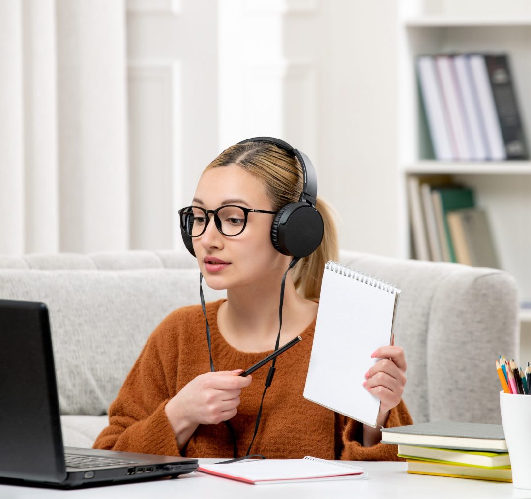 student-online-cute-girl-glasses-sweater-studying-computer-showing-notes